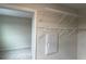 This walk-in closet has wire shelving and rods, offering ample and organized storage solutions at 5099 Prairie Preserve Run, St Cloud, FL 34772