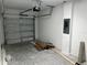 Spacious garage featuring an automatic door, concrete flooring, and ample storage space at 5099 Prairie Preserve Run, St Cloud, FL 34772
