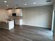 Open-concept living and dining area with recessed lighting, tile flooring, and modern kitchen at 5099 Prairie Preserve Run, St Cloud, FL 34772