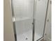 Glass-enclosed shower features modern tile, a clean design, and a luxurious bathing experience at 5099 Prairie Preserve Run, St Cloud, FL 34772