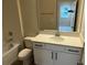 Bathroom featuring a shower-tub, toilet, large mirror, and vanity with white cabinets at 5103 Prairie Preserve Run, St Cloud, FL 34772