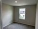 Bedroom with neutral walls and carpeted floor, featuring a window at 5103 Prairie Preserve Run, St Cloud, FL 34772
