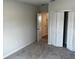 Bedroom with neutral walls and carpeted floor, featuring a closet at 5103 Prairie Preserve Run, St Cloud, FL 34772