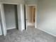 Bedroom with neutral walls, carpeted floor, closet, and ensuite bathroom at 5103 Prairie Preserve Run, St Cloud, FL 34772