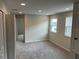 Bonus room with carpet and two windows for natural light at 5103 Prairie Preserve Run, St Cloud, FL 34772