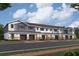 New townhome with stone facade, brick sidewalk and two car garage at 5103 Prairie Preserve Run, St Cloud, FL 34772