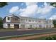 Townhome exterior with stone accents and brick pavers leading to the garage at 5103 Prairie Preserve Run, St Cloud, FL 34772