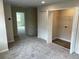 Upstairs hallway including access to a bedroom and laundry area at 5103 Prairie Preserve Run, St Cloud, FL 34772
