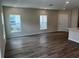 Spacious living area featuring tile floors and large windows for abundant natural light at 5103 Prairie Preserve Run, St Cloud, FL 34772