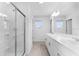 Bathroom featuring double sink vanity, glass shower, and sleek fixtures at 5109 Forget Me Not Ave, Lake Hamilton, FL 33851