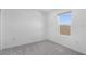Bright bedroom features plush gray carpeting and a window allowing ample natural light at 5109 Forget Me Not Ave, Lake Hamilton, FL 33851