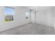 Bright bedroom with large windows, double door closet, and plush carpet at 5109 Forget Me Not Ave, Lake Hamilton, FL 33851
