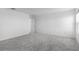 Spacious carpeted bedroom featuring a neutral color scheme at 5109 Forget Me Not Ave, Lake Hamilton, FL 33851