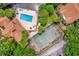 Aerial view of a community pool and tennis court at 5452 E Michigan St # 7, Orlando, FL 32812