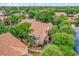 Aerial view of a condo complex with ponds, mature trees, and well-manicured landscaping at 5452 E Michigan St # 7, Orlando, FL 32812
