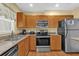Well-equipped kitchen with stainless steel appliances and granite countertops at 5452 E Michigan St # 7, Orlando, FL 32812