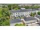 An aerial view of the townhouses, garages, and surrounding greenery at 5489 Baldwin Park St, Orlando, FL 32814