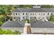 Overhead view of townhomes with manicured lawns and detached two-car garages at 5489 Baldwin Park St, Orlando, FL 32814