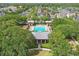 Aerial view of community pool with cabana, playground and residential homes at 5489 Baldwin Park St, Orlando, FL 32814