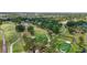 Picturesque aerial view of the golf course with water features, winding paths, and tree-lined fairways at 5489 Baldwin Park St, Orlando, FL 32814