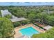 Aerial view of community pool, playground, long lake and surrounding homes at 5489 Baldwin Park St, Orlando, FL 32814