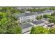 This aerial view features townhouses, garages, and lush foliage at 5489 Baldwin Park St, Orlando, FL 32814