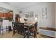 Charming dining area featuring a wooden table set and adjacent kitchen at 5489 Baldwin Park St, Orlando, FL 32814