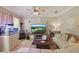 Cozy living room featuring a large screen television, stylish decor, and comfortable seating at 5489 Baldwin Park St, Orlando, FL 32814
