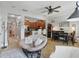 Spacious living area seamlessly connects with the kitchen and dining space, with tile flooring at 5489 Baldwin Park St, Orlando, FL 32814