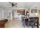 Open living space with tile floors, modern fixtures, and a view into the kitchen at 5489 Baldwin Park St, Orlando, FL 32814