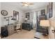 Comfortable home office with desk, chair, decor, and natural light through the window at 5489 Baldwin Park St, Orlando, FL 32814