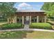 Exterior of community pavilion with stone columns and manicured landscaping at 5489 Baldwin Park St, Orlando, FL 32814