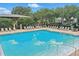 Large community pool with lounge chairs and a fun playground at 5489 Baldwin Park St, Orlando, FL 32814