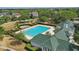 Aerial view of the community pool with multiple lanes, a kiddie pool, and ample seating at 5489 Baldwin Park St, Orlando, FL 32814