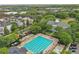 Aerial view of the resort-style pool and recreational area, complete with lounge chairs and lush landscaping at 5489 Baldwin Park St, Orlando, FL 32814