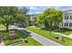 Community street view with well-manicured lawns and uniform, elegant home exteriors at 5489 Baldwin Park St, Orlando, FL 32814