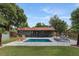 Backyard with a swimming pool, outdoor seating area, and a well-maintained lawn at 550 Birch Ct, Altamonte Springs, FL 32714