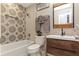 Updated bathroom with stylish tile, wood vanity, and modern fixtures at 550 Birch Ct, Altamonte Springs, FL 32714