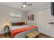A well-lit bedroom featuring a spacious closet and a ceiling fan at 550 Birch Ct, Altamonte Springs, FL 32714