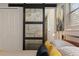 A bedroom featuring a unique sliding barn door at 550 Birch Ct, Altamonte Springs, FL 32714