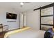 Bedroom with a TV, barn door, and ensuite closet at 550 Birch Ct, Altamonte Springs, FL 32714