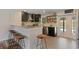 Open kitchen featuring granite countertops, stainless appliances, and pool access at 550 Birch Ct, Altamonte Springs, FL 32714