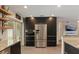 Modern kitchen featuring stainless fridge, oven, microwave, and dark cabinets at 550 Birch Ct, Altamonte Springs, FL 32714