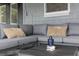 Covered patio with cozy sectional sofa and decorative pillows, perfect for relaxing at 550 Birch Ct, Altamonte Springs, FL 32714