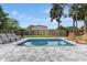 Relaxing pool area featuring modern chaise lounges and inviting wicker chairs with side table at 550 Birch Ct, Altamonte Springs, FL 32714