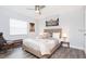 Comfortable bedroom with a ceiling fan, stylish furnishings, and a large window for natural light at 631 Trailwood Dr, Altamonte Springs, FL 32714