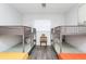 Bedroom features two bunk beds with twin mattresses, a ceiling fan, and a modern bench at 631 Trailwood Dr, Altamonte Springs, FL 32714