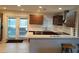 Modern kitchen with stainless steel appliances, breakfast bar, and access to the outdoor patio at 631 Trailwood Dr, Altamonte Springs, FL 32714