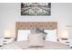 Close up of bed in a main bedroom with luxurious linens, pillows, bedside tables and lamps at 631 Trailwood Dr, Altamonte Springs, FL 32714