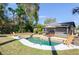 Private backyard pool with lush greenery, patio area, and lounge chairs for serene outdoor living at 631 Trailwood Dr, Altamonte Springs, FL 32714